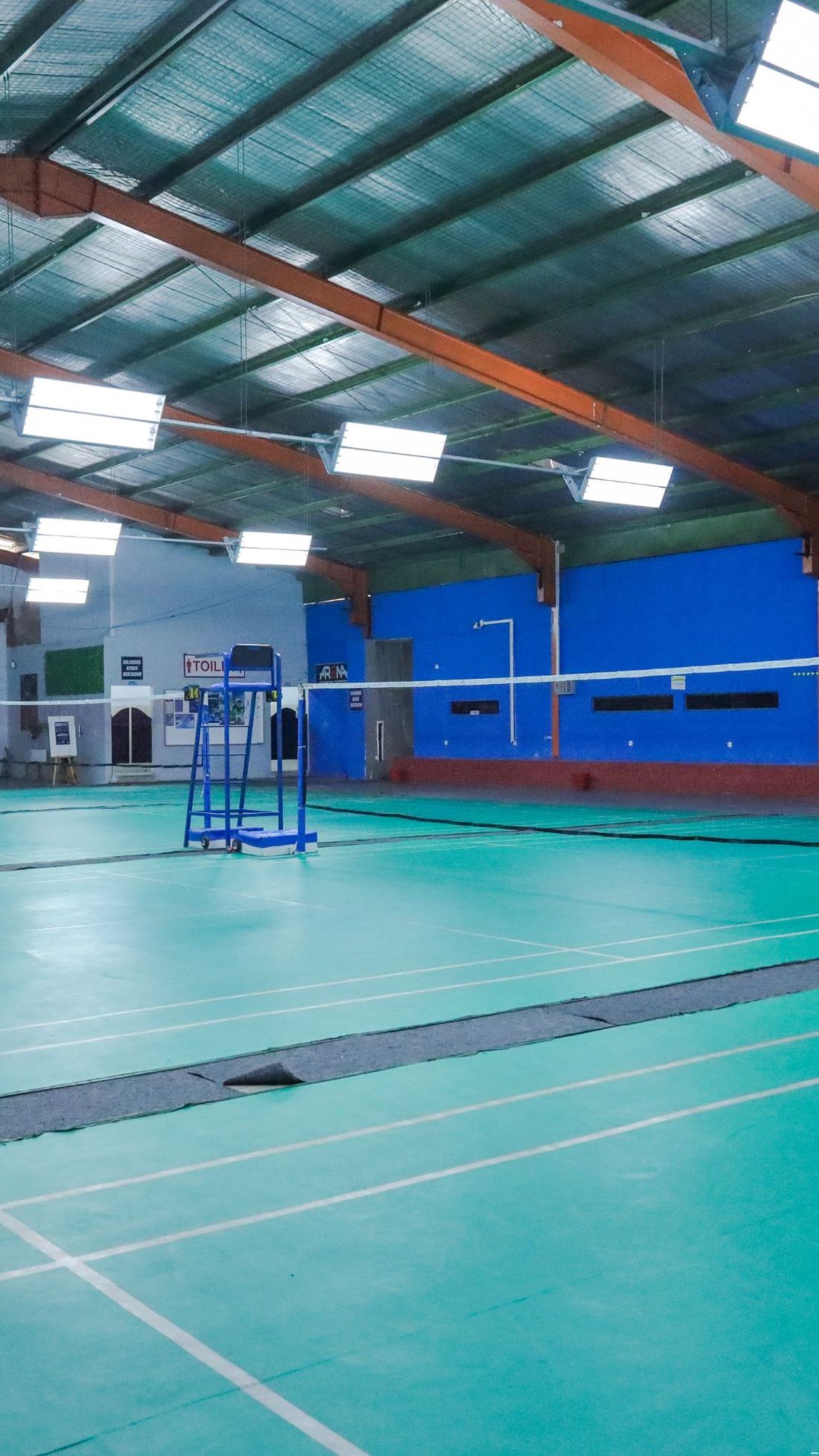 A real badminton hall with several courts