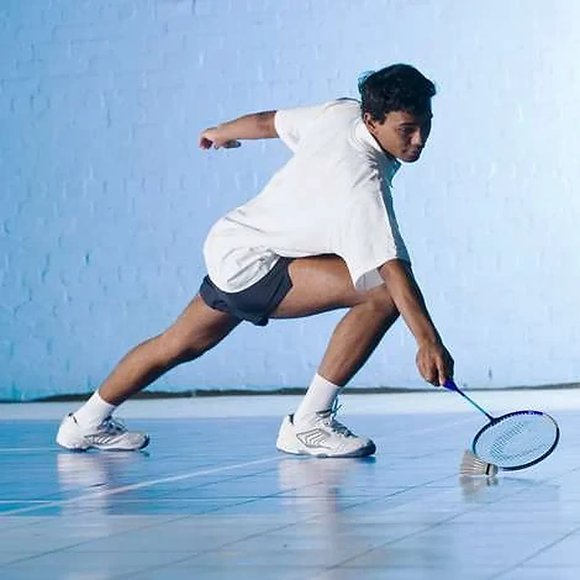 A player stretches for a low shuttle