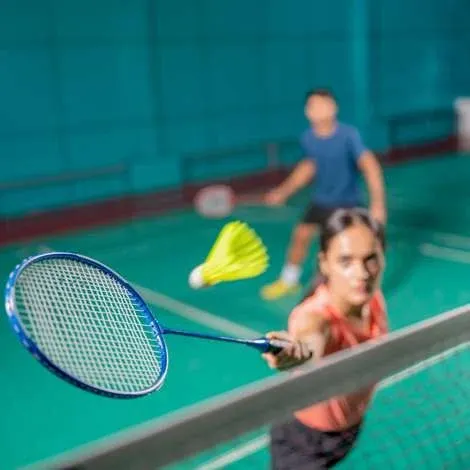 Two players at the net during a doubles rally